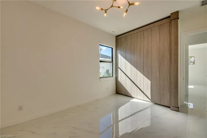 Empty room featuring a chandelier