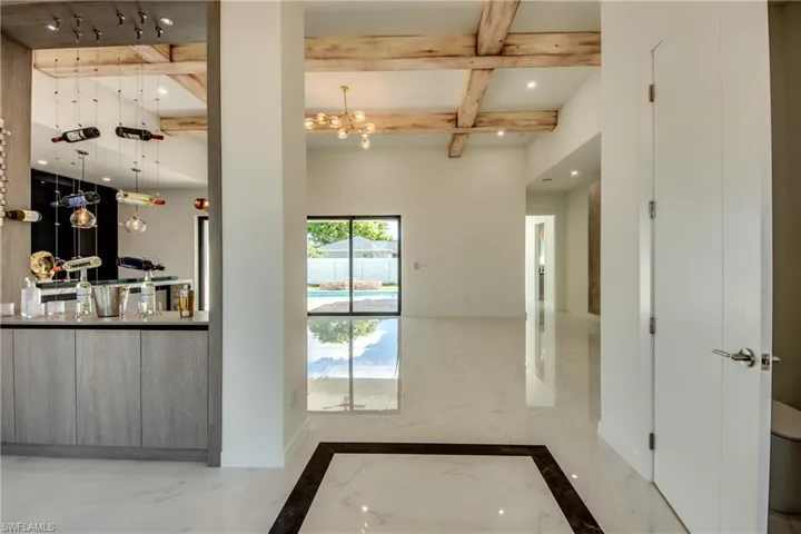 Foyer with office nook and wine cooler