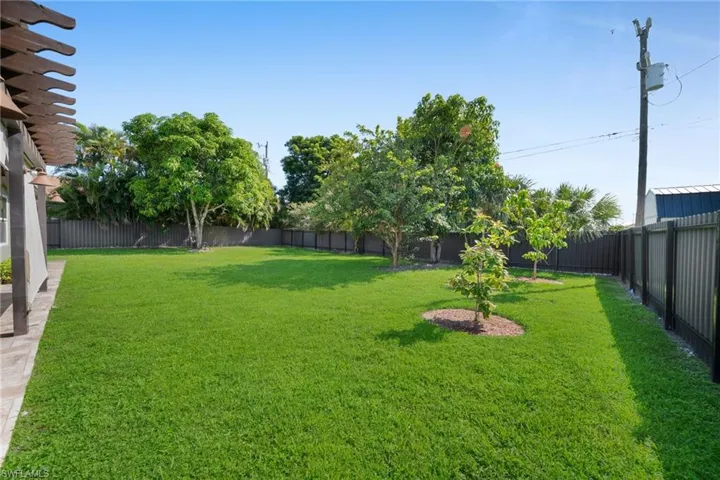 View of fenced backyard