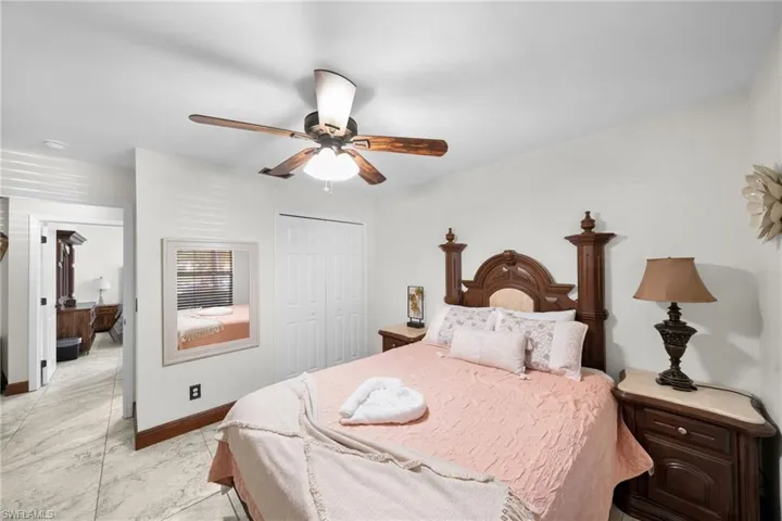 Bedroom with a closet and ceiling fan
