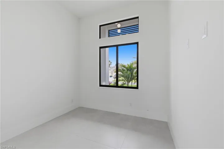 Spare room featuring baseboards