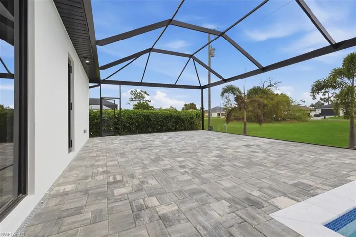 View of patio / terrace featuring a lanai and a sunroom