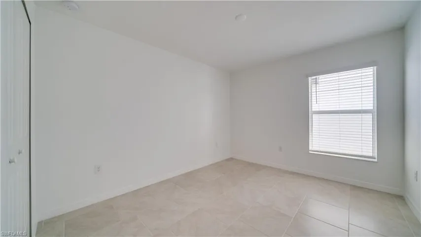 Spare room featuring baseboards