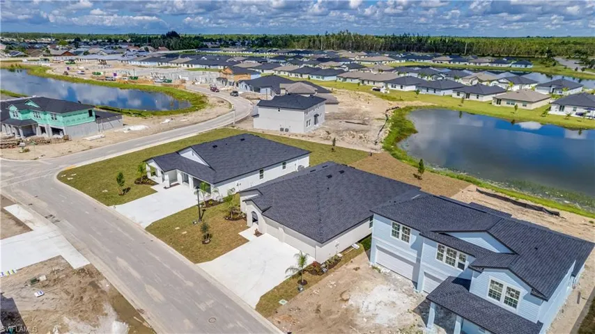 Aerial view of residential area with a nearby body of water