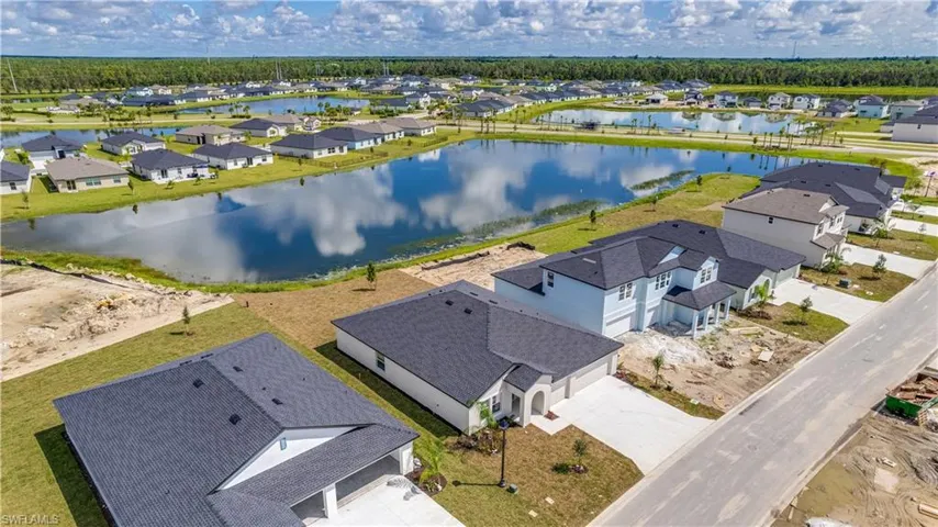 Aerial view of residential area with a large body of water
