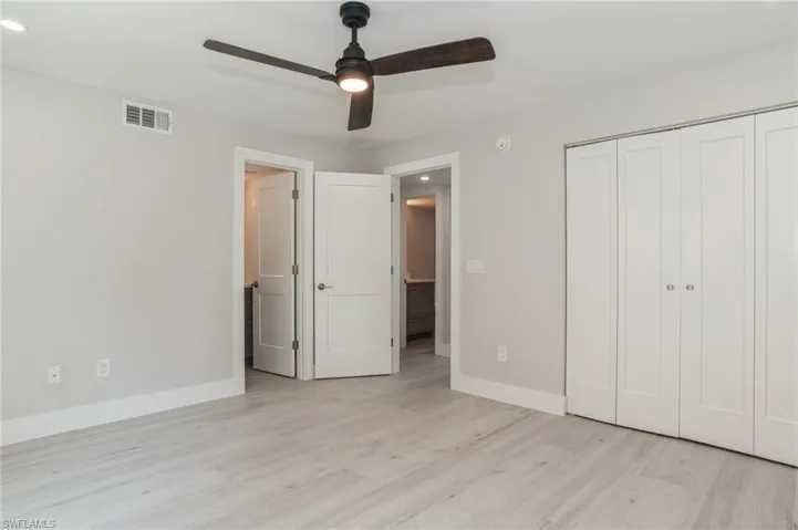 Spare room with light wood-style flooring, ceiling fan, and recessed lighting