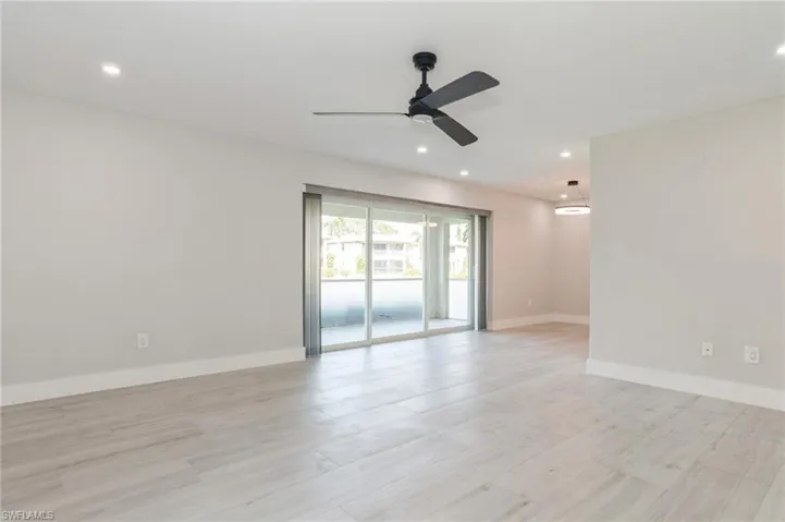 Spare room featuring ceiling fan, light wood finished floors, and recessed lighting
