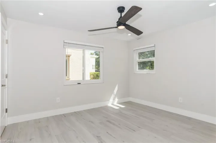 Full bathroom featuring a stall shower and vanity