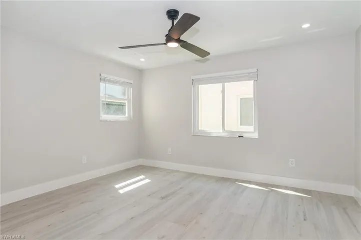 Unfurnished dining area featuring light wood-style floors and recessed lighting