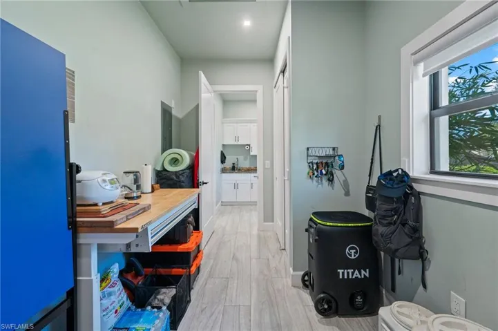 Hall featuring light wood-style floors and baseboards