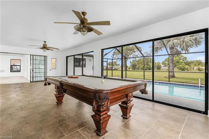 Rec room with billiards, tile flooring, and ceiling fan
