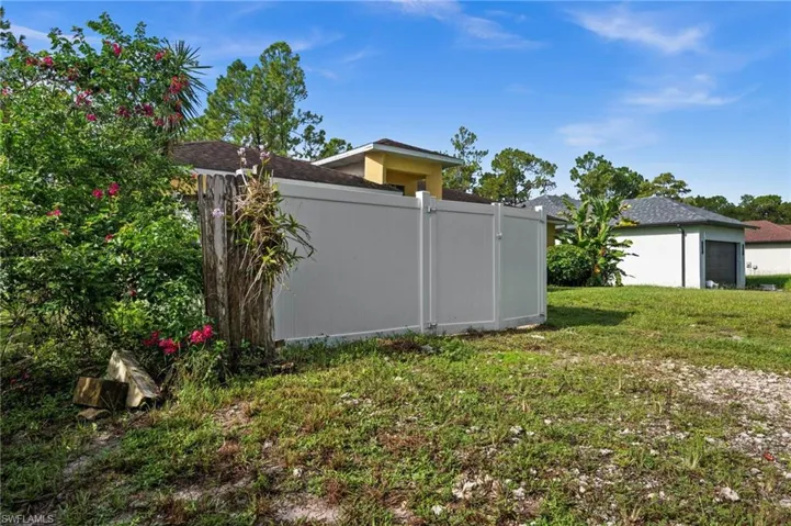 Privacy Fenced Courtyard in Front of Garage