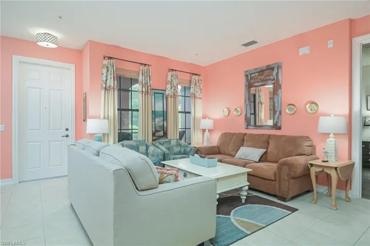 Living room with light tile floors