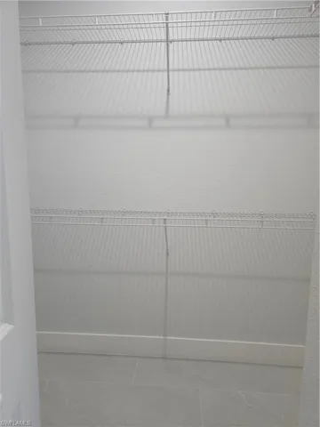 Spacious closet featuring tile patterned floors