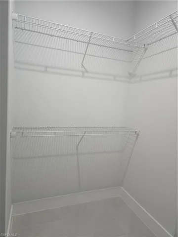 Spacious closet with tile patterned flooring