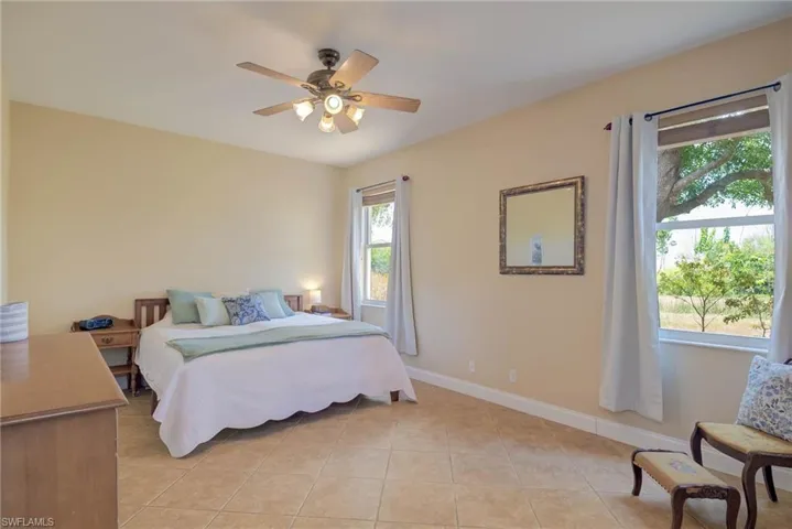 Downstairs primary bedroom with views of preserve.