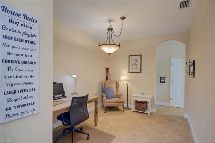 Formal dining space being used as an office.