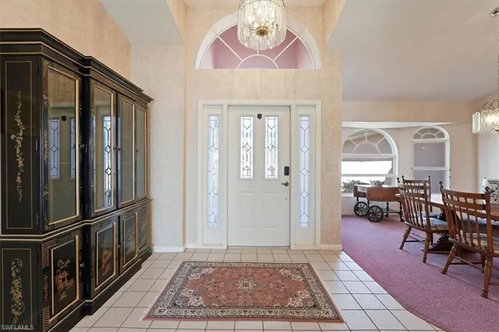 Entryway with vaulted ceiling, across from Living Room's sliding glass doors, providing an incredible view upon entry