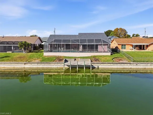 Rear of home showing dock & seawall