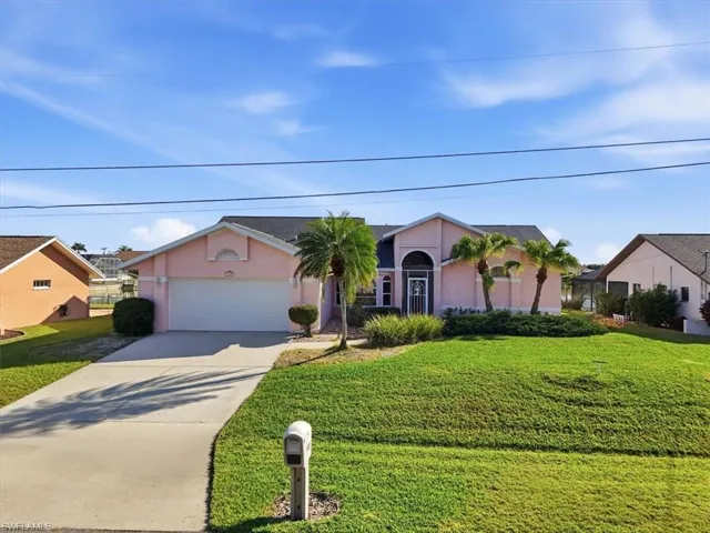 Florida ranch-style home with concrete driveway, stucco finish over block