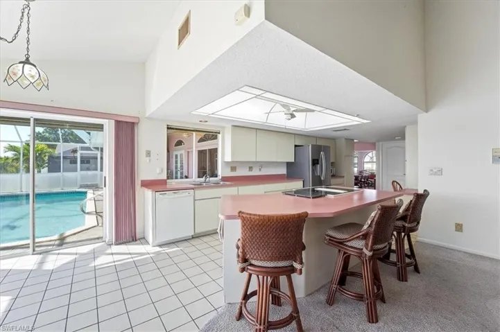 Kitchen with a breakfast bar, overlooking the Family room