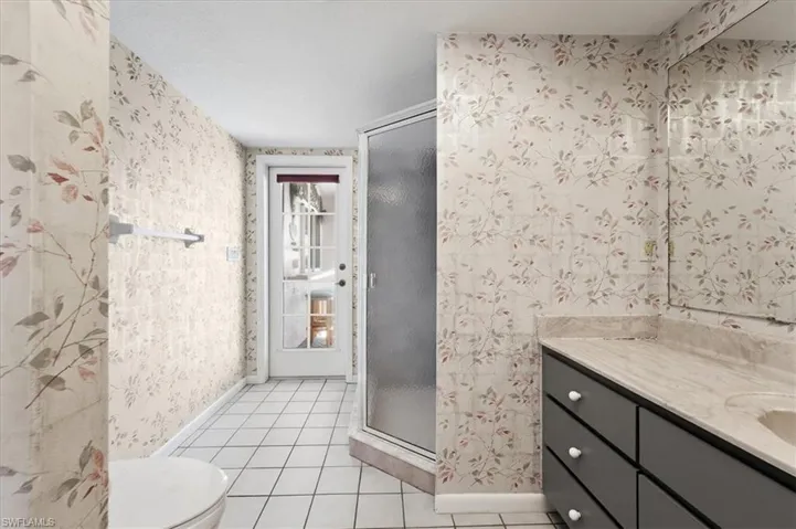Guest bathroom DOUBLES as the pool bath having direct access to lanai