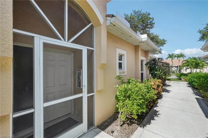 Entrance to property featuring stucco siding
