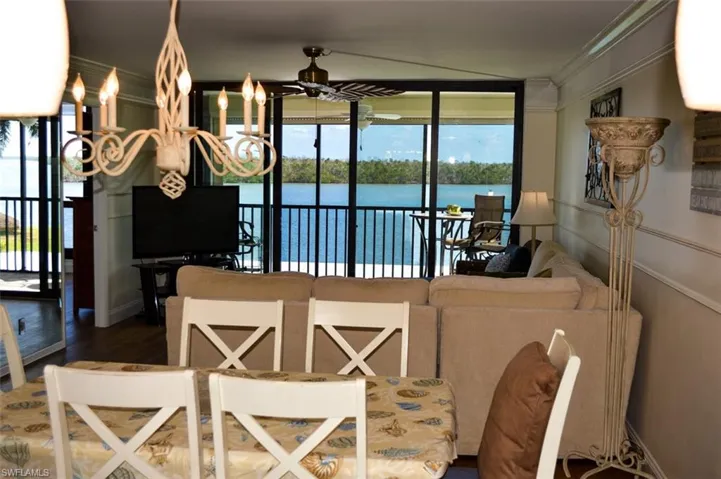 VIEW FROM DINING AREA OF ESTERO BAY.  ENTRANCE TO OWNER'S SUITE SHOWN AT MIDDLE LEFT.