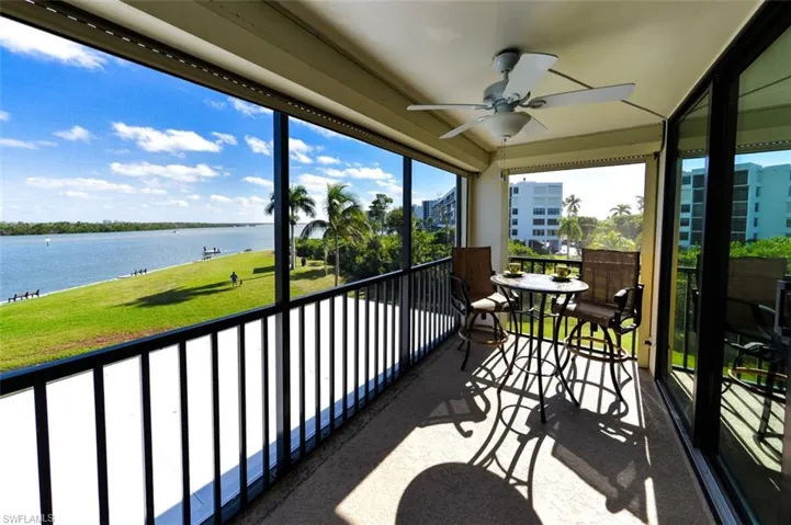 FULL ESTERO BAY VIEWS FROM THE SCREENED LANAI.  ELECTRIC STORM SHUTTERS.  ENTRANCE TO LIVING AREA IS TO RIGHT.