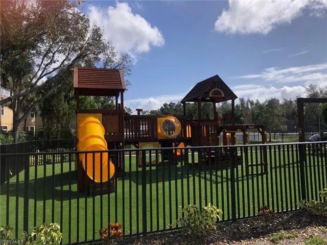View of play area with a yard