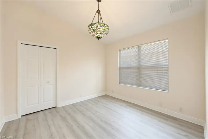 guest room with light hardwood / wood-style floors