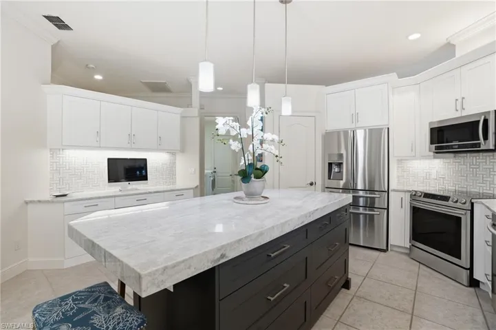 Built in Desk, Island, Walk in Pantry, leading to hallway, Dining Room, Guest Quarters