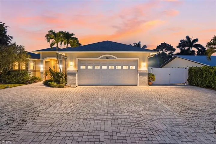 Extended Paver Driveway w/ room on side of house to store Boat, Trailer behind White Gate