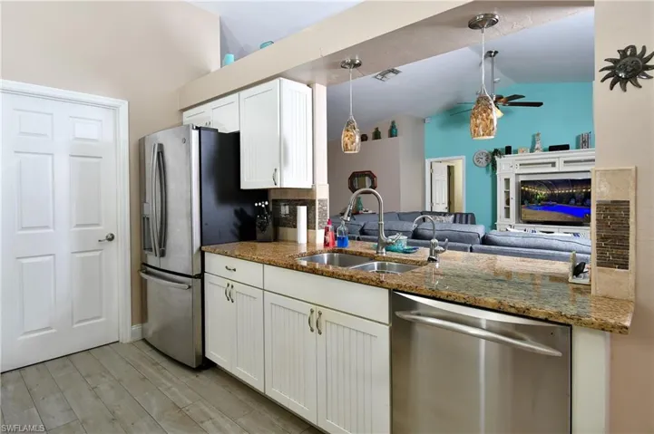 Kitchen with upgraded cabinets and granite countertops.