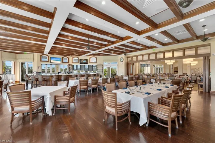 Dining area featuring visible vents, coffered ceiling, beamed ceiling, and hardwood / wood-style floors