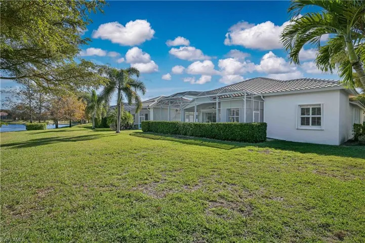Rear of home featuring large Lanai !