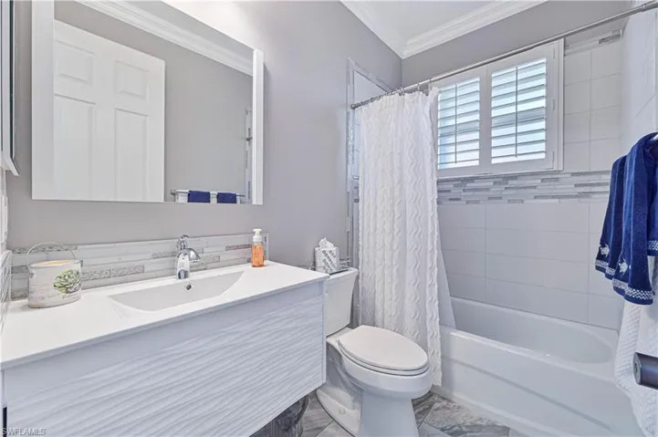 2nd full bath with floating cabinets, tub and shower and plantation shutters !