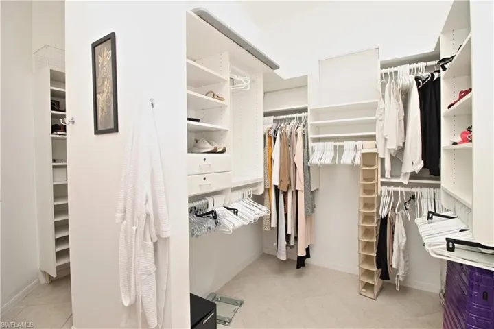 Walk in closet featuring light tile patterned floors