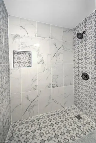Full bathroom featuring vanity, shower / bath combination with curtain, and toilet