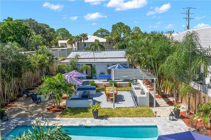 View of patio / terrace with a fenced in pool and a pergola
