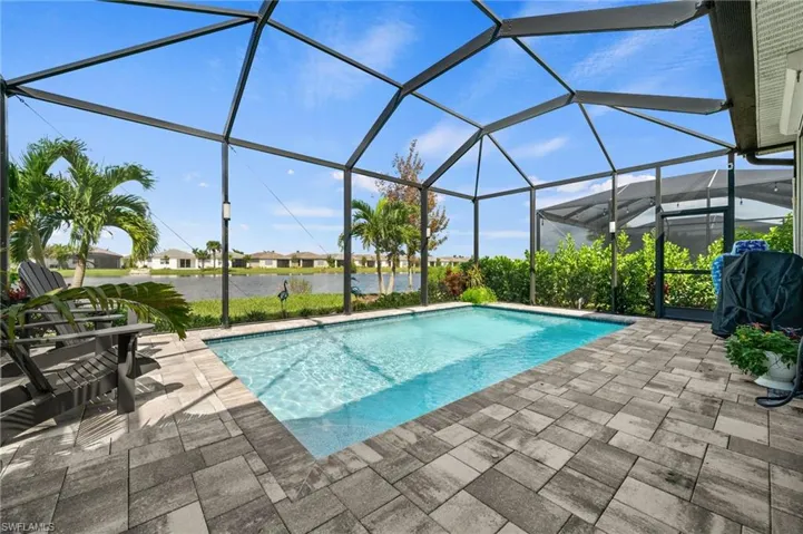 View of pool featuring a patio and a lanai