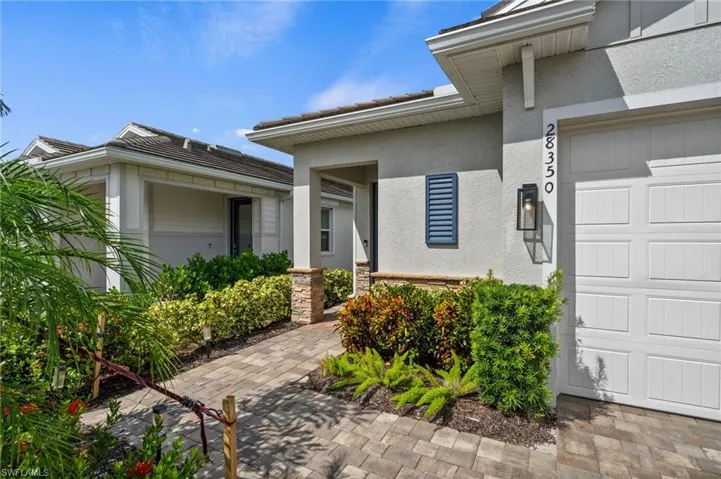 Property entrance with a garage