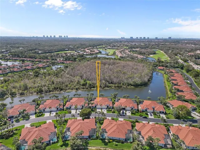 Birds eye view of property featuring a residential view and a water view