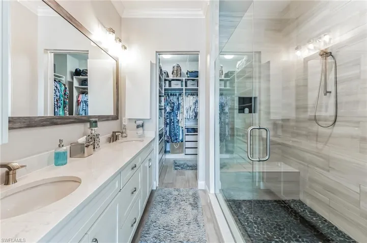 Dual sinks, huge walk-in shower.