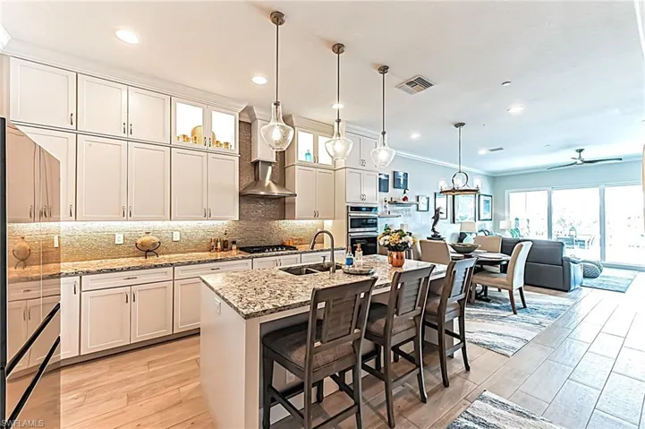 Luxurious granite backsplash, upgraded ceiling height cabinets