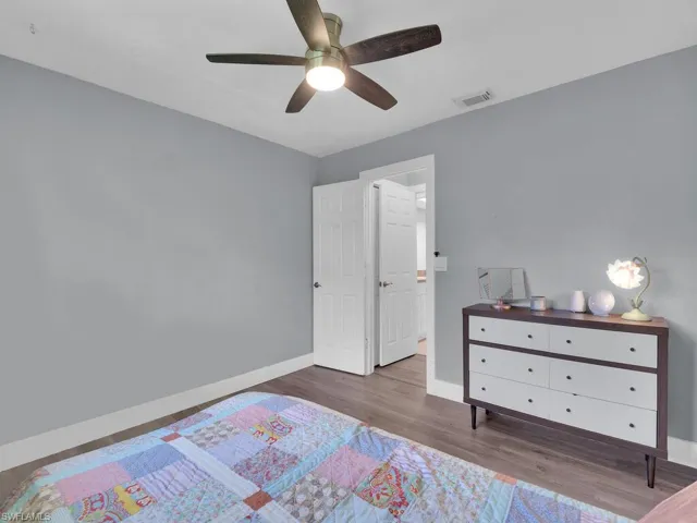 Bedroom featuring wood finished floors and a ceiling fan