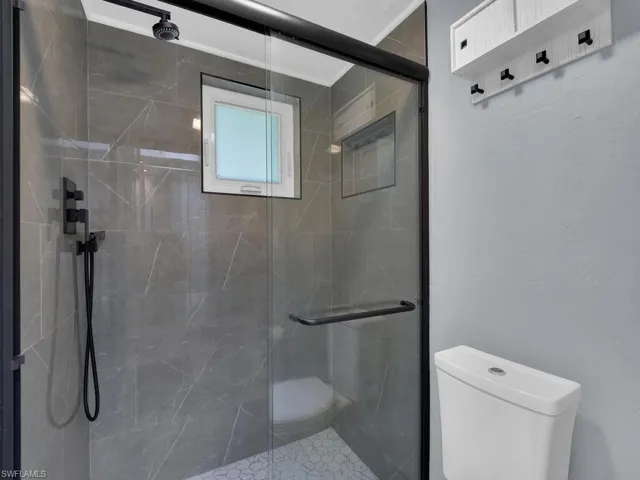 Full bath featuring a stall shower