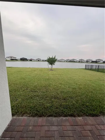 View of yard with a water view