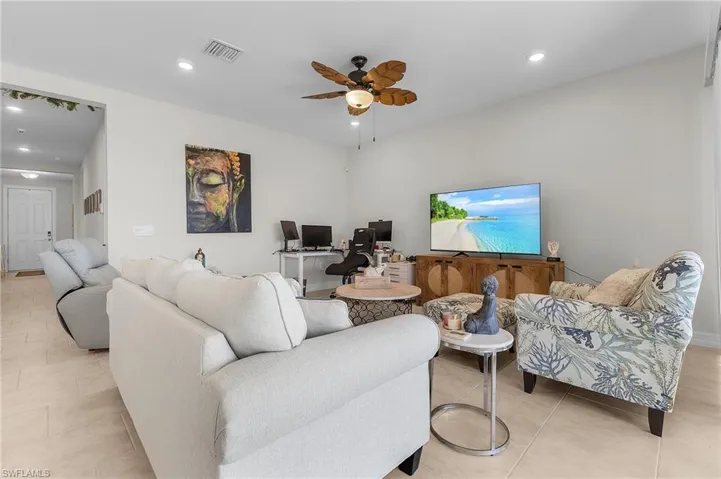 Tiled living room with ceiling fan