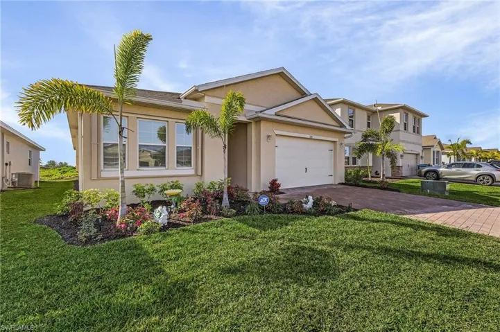 Single story home featuring a front lawn and central air condition unit